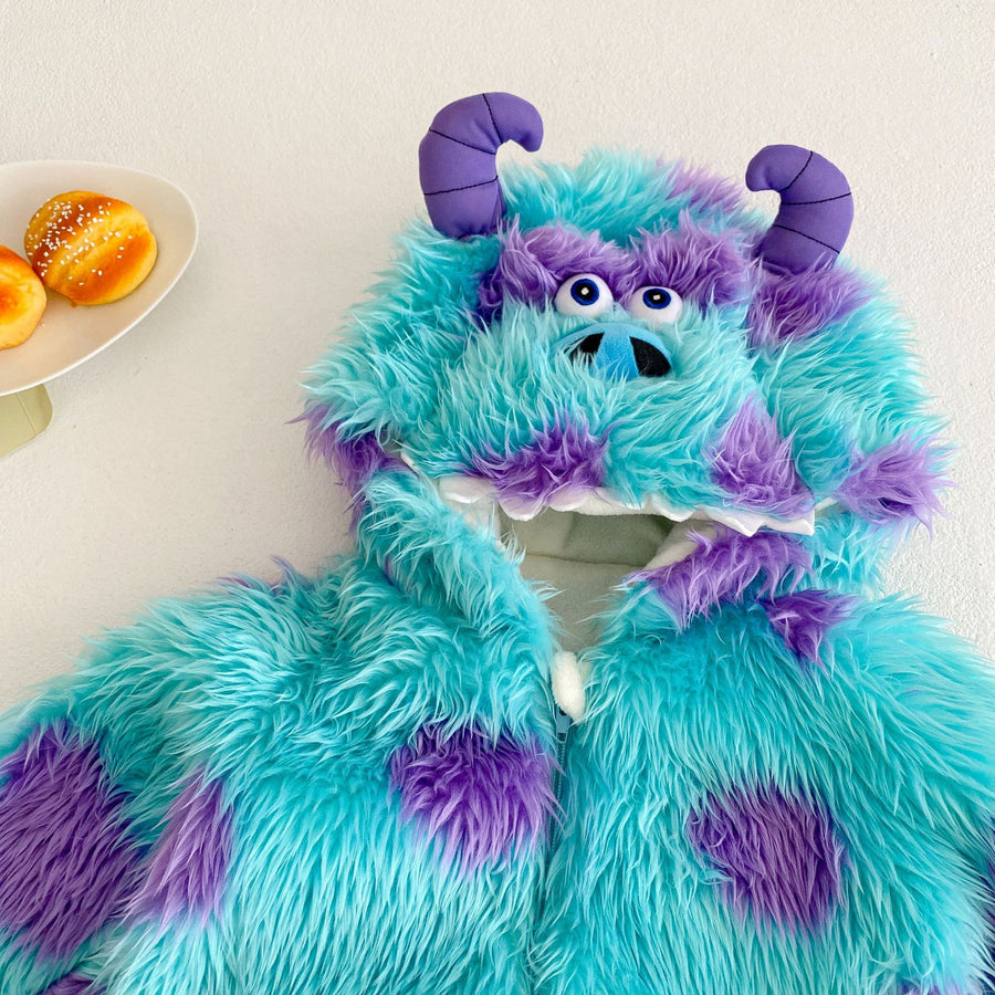 The hood laid flat, showing the blue eyes, blue muzzle, white felt teeth and two padded purple horns