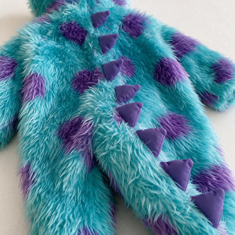 Close-up of the padded purple spikes running down the back and tail